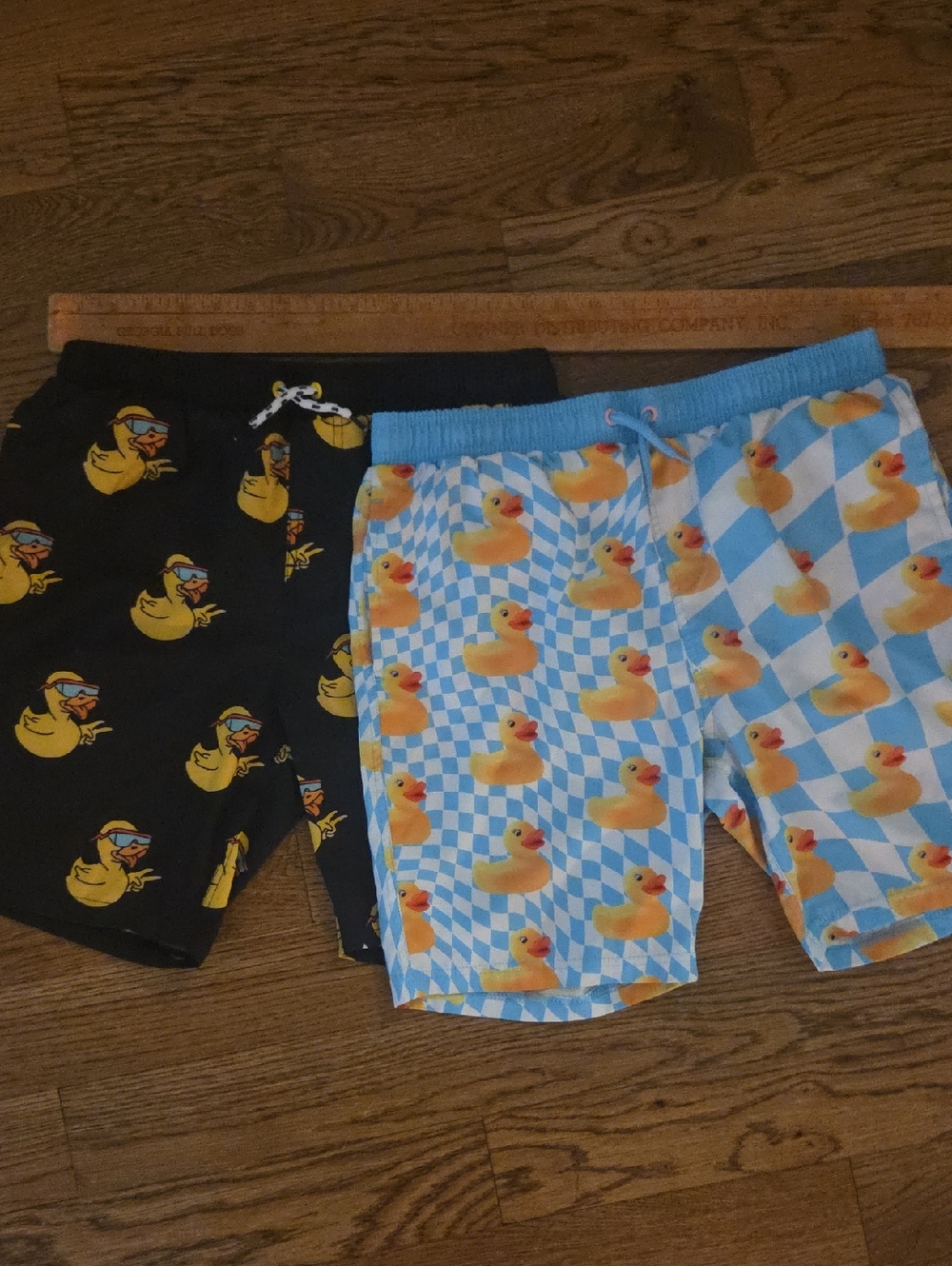 Neff Men's Black & Light Blue Swim Trunks with Yellow Duck Pattern